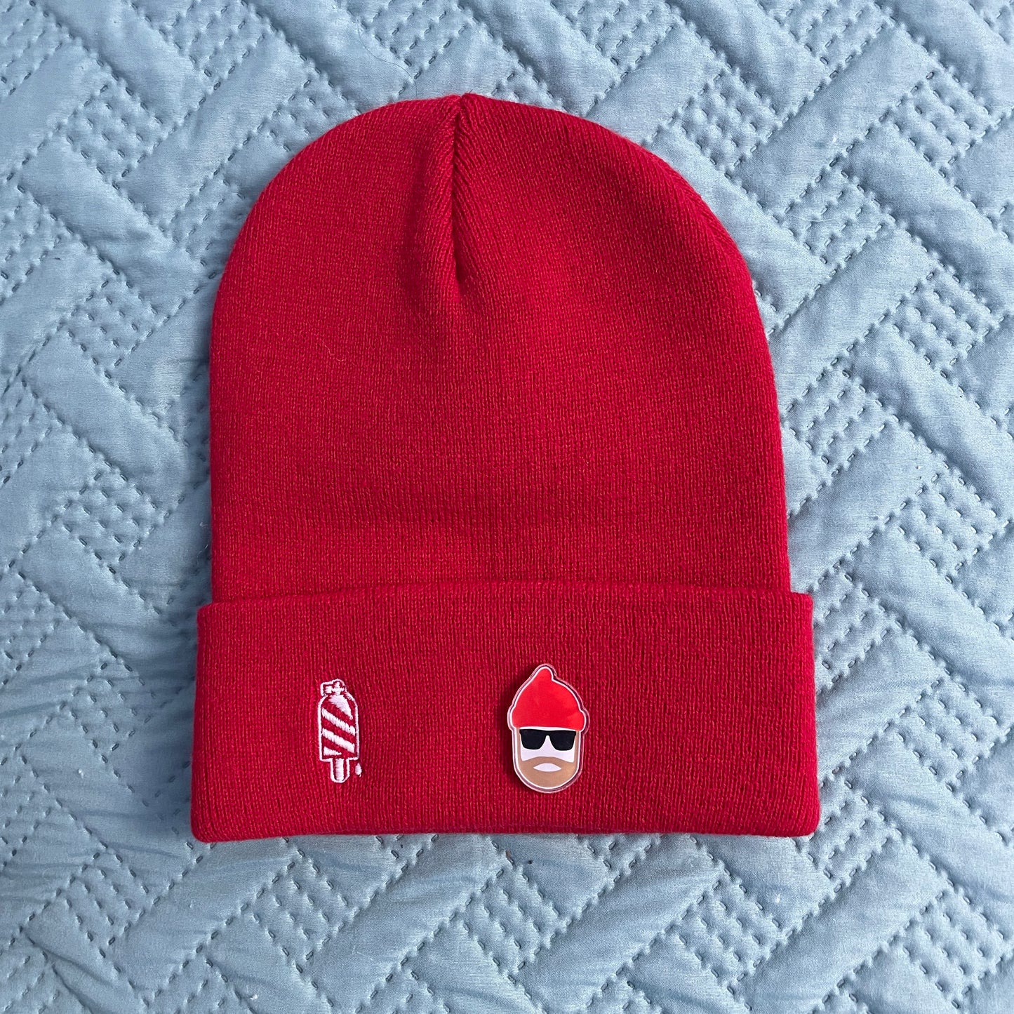 Scuba diver acrylic pin on red beanie
